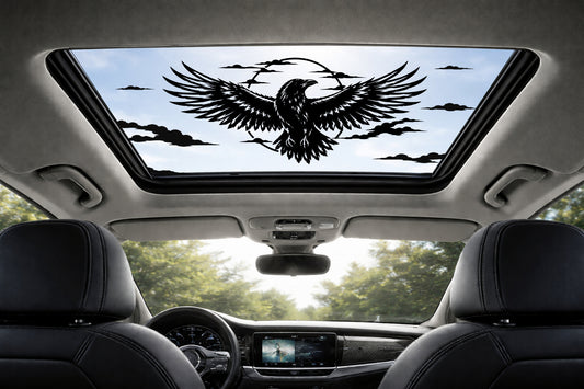 Car interior with a sunroof featuring an raven design.